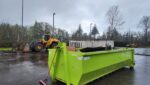 20-yard roll-off dumpster rental at Seattle construction jobsite with heavy equipment